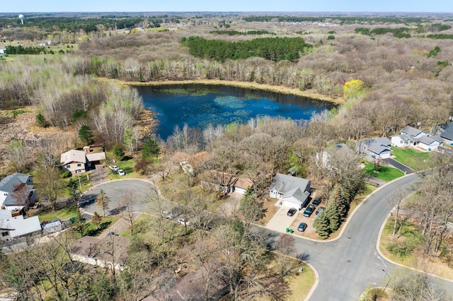 drone / aerial view with a water view, a residential view, and a forest view