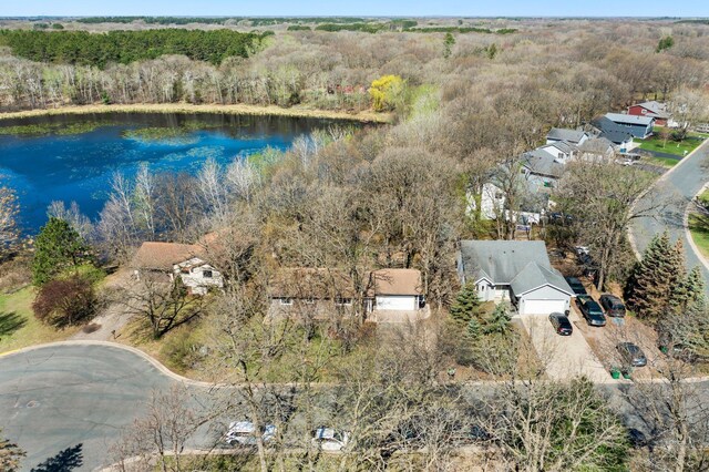 bird's eye view featuring a water view and a wooded view