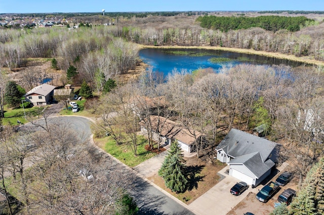 aerial view featuring a view of trees and a water view