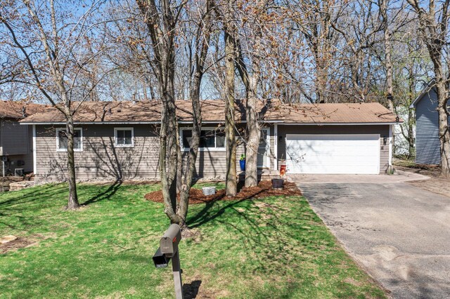 single story home featuring driveway and a front lawn
