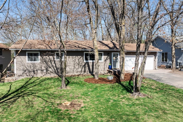 single story home with a garage, a front lawn, and aphalt driveway