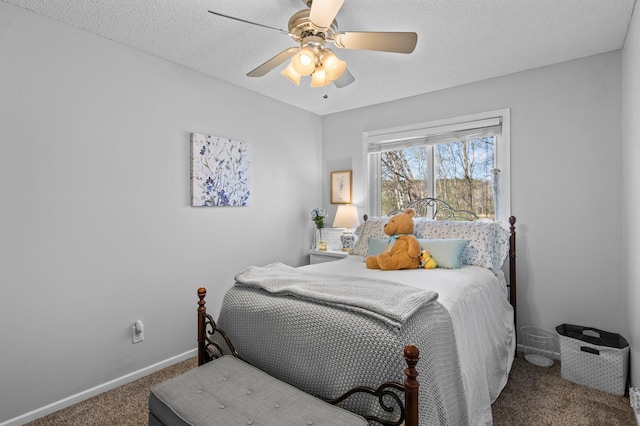 bedroom featuring baseboards, carpet, a ceiling fan, and a textured ceiling