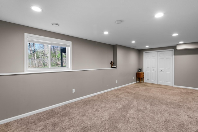 interior space featuring recessed lighting, carpet flooring, and baseboards