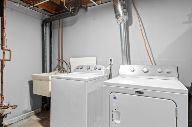 clothes washing area with independent washer and dryer and laundry area