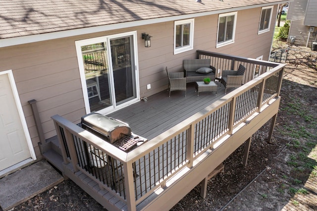 wooden terrace featuring an outdoor hangout area