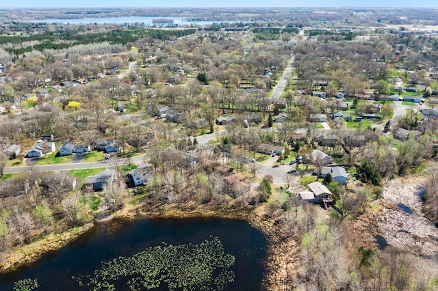 birds eye view of property featuring a residential view and a water view
