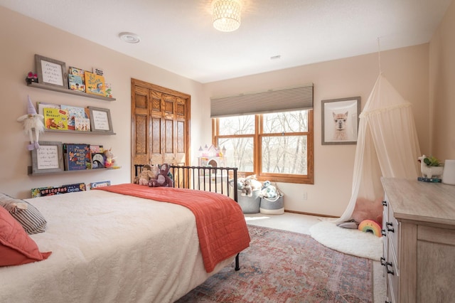 carpeted bedroom with baseboards