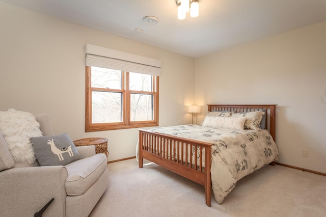 bedroom featuring baseboards and carpet floors