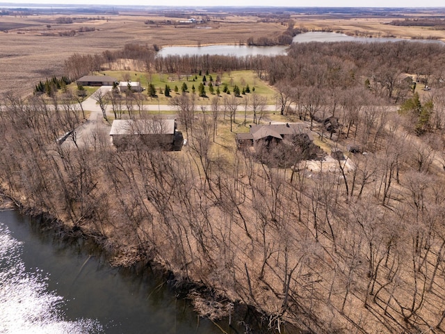 birds eye view of property with a water view and a rural view