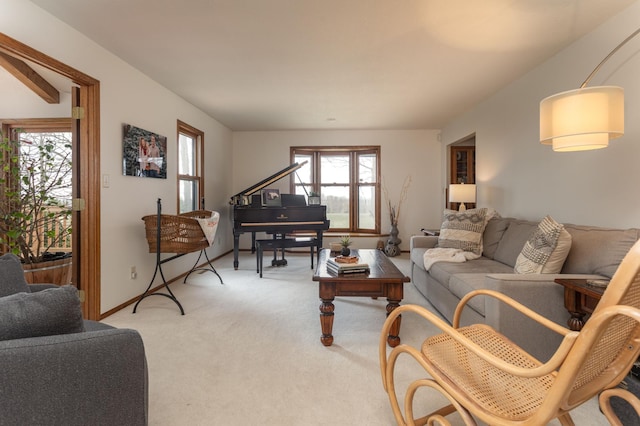 living room featuring light colored carpet and plenty of natural light