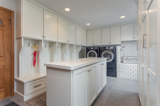 washroom with cabinet space, tile patterned flooring, washer and dryer, and recessed lighting