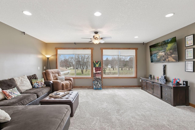 14921 Zeolite St NW, Ramsey, MN 55303 - living room featuring light colored carpet, a textured ceiling, baseboards, and a ceiling fan