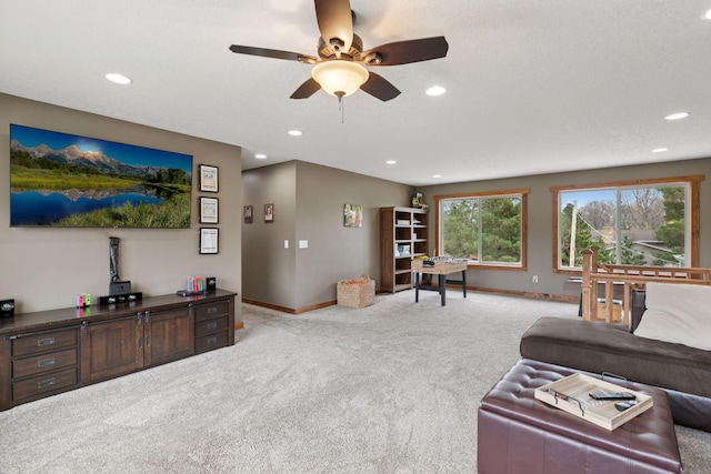 14921 Zeolite St NW, Ramsey, MN 55303 - carpeted living room with baseboards, ceiling fan, and recessed lighting