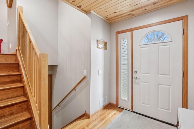 14921 Zeolite St NW, Ramsey, MN 55303 - entrance foyer featuring light wood finished floors, crown molding, visible vents, baseboards, and wooden ceiling