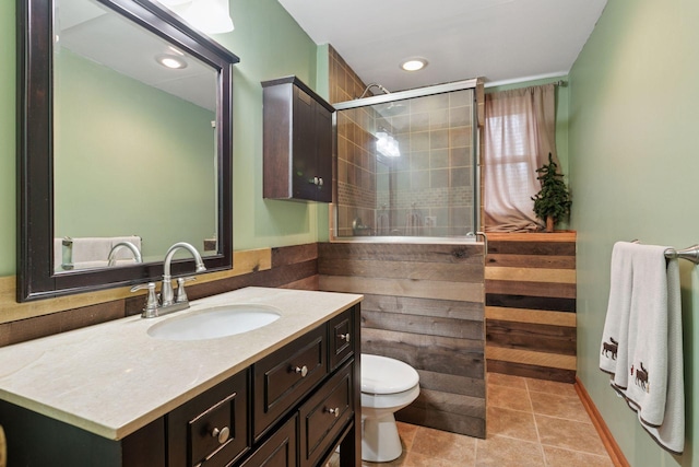 14921 Zeolite St NW, Ramsey, MN 55303 - full bathroom with recessed lighting, toilet, a tile shower, tile patterned floors, and vanity
