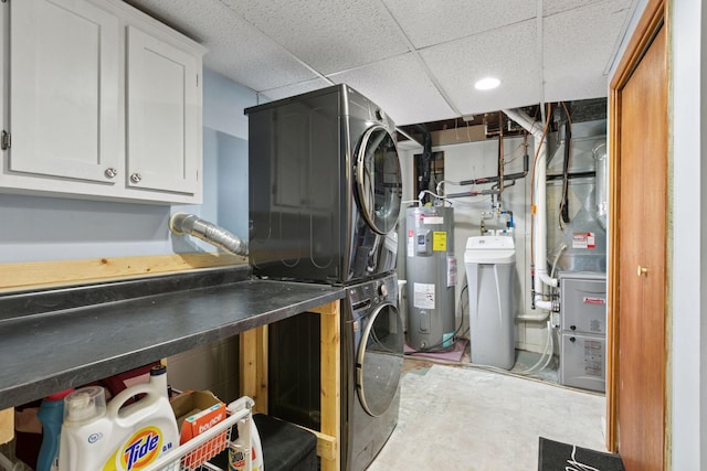 14921 Zeolite St NW, Ramsey, MN 55303 - laundry room featuring recessed lighting, heating unit, stacked washer and clothes dryer, electric water heater, and cabinet space