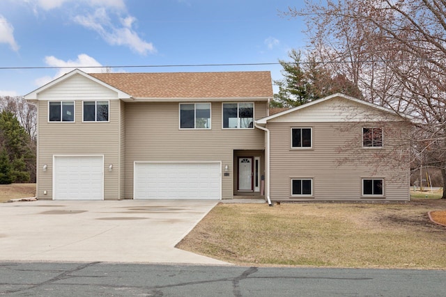 14921 Zeolite St NW, Ramsey, MN 55303 - view of front of property with a garage, a front lawn, a shingled roof, and driveway