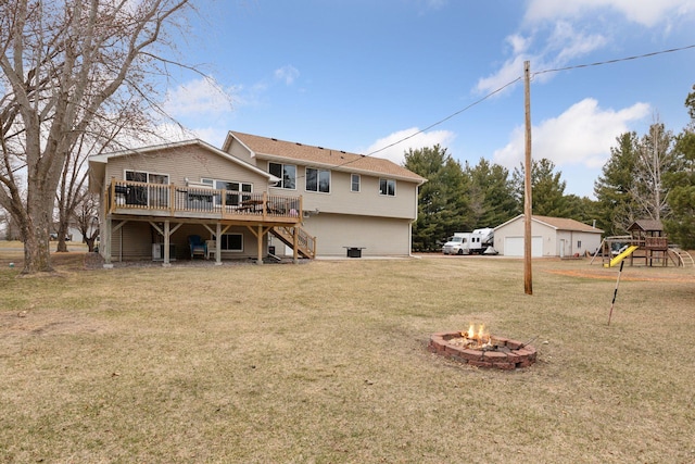 14921 Zeolite St NW, Ramsey, MN 55303 - rear view of property featuring a garage, an outdoor fire pit, a playground, a deck, and stairway