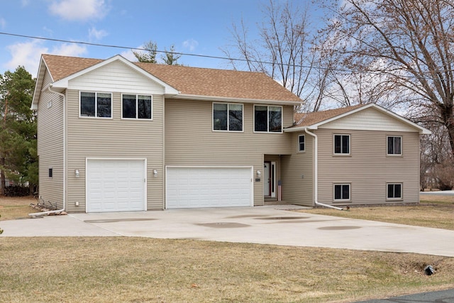 14921 Zeolite St NW, Ramsey, MN 55303 - view of front of property featuring concrete driveway, a front lawn, roof with shingles, and a garage
