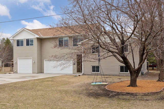 14921 Zeolite St NW, Ramsey, MN 55303 - view of front of property featuring concrete driveway, an attached garage, and a front lawn