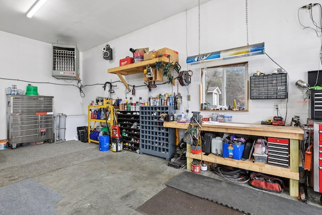 14921 Zeolite St NW, Ramsey, MN 55303 - garage featuring a workshop area and a heating unit