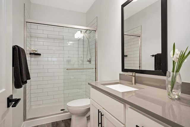 6369 16th Ave S, Richfield, MN 55423 - full bathroom with vanity, a shower stall, and wood finished floors