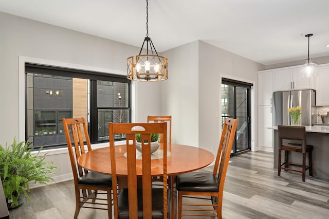 6369 16th Ave S, Richfield, MN 55423 - dining space with light wood-style floors and a chandelier