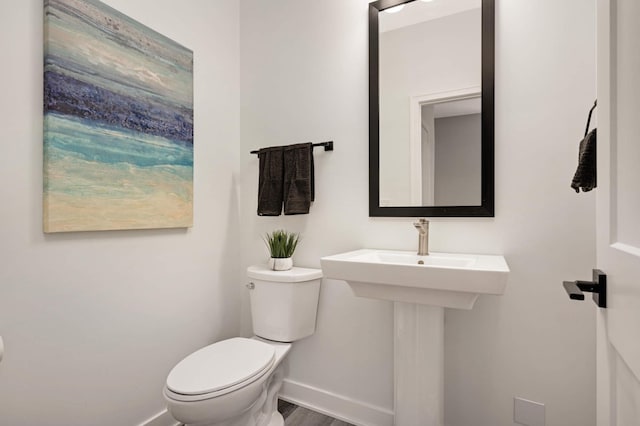 6369 16th Ave S, Richfield, MN 55423 - bathroom featuring baseboards and wood finished floors