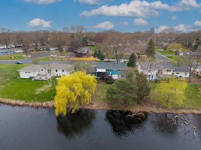 birds eye view of property with a water view and a residential view