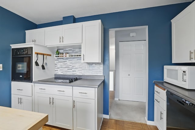 kitchen with white cabinetry, open shelves, black appliances, and tasteful backsplash