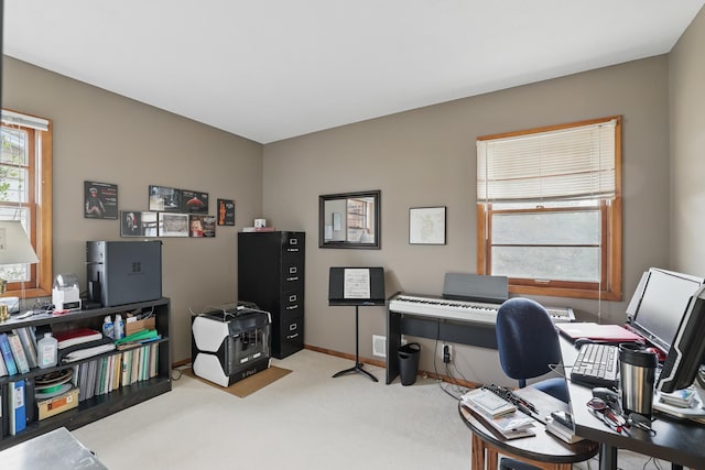 home office with carpet floors and baseboards