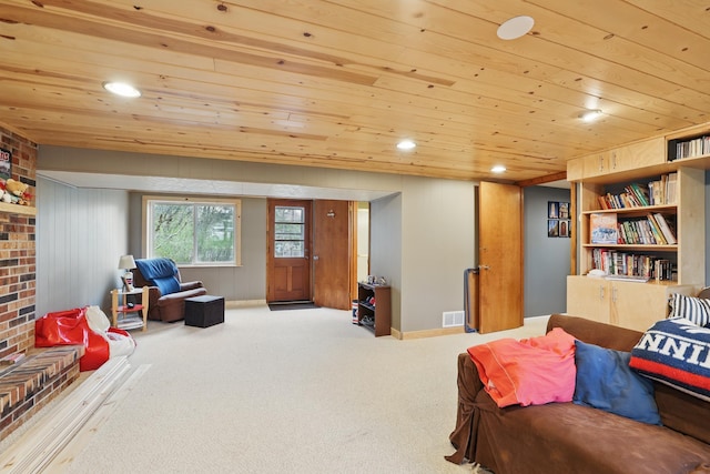 sitting room featuring visible vents, carpet flooring, recessed lighting, and wooden ceiling
