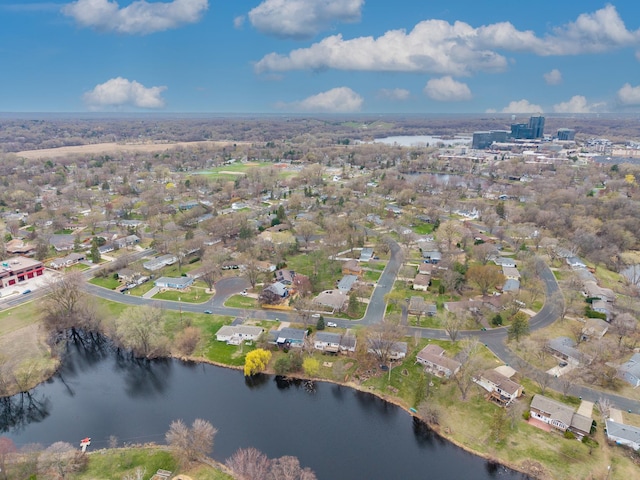birds eye view of property featuring a water view and a residential view