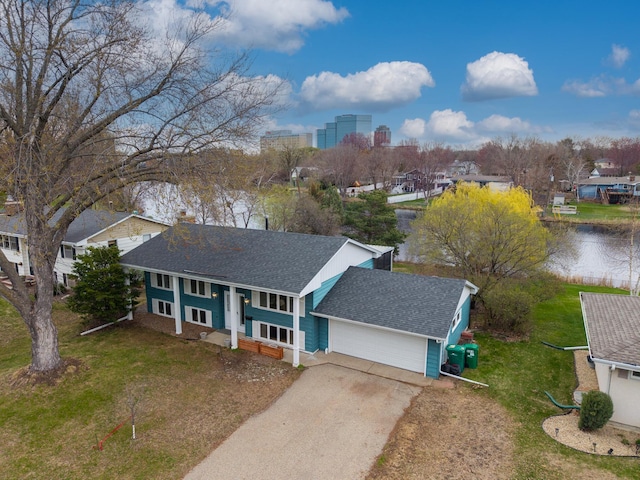 bird's eye view with a water view and a residential view