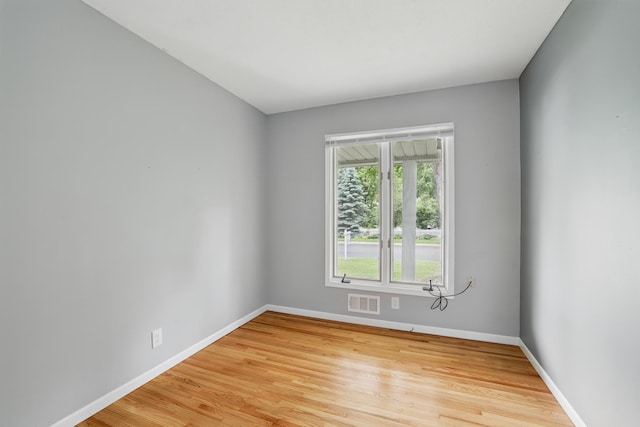 8307 Johnson Ave S, Bloomington, MN 55437 - unfurnished room featuring baseboards and light wood-type flooring