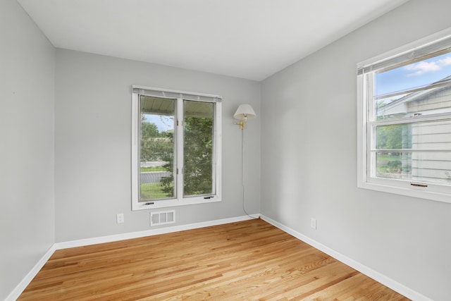 8307 Johnson Ave S, Bloomington, MN 55437 - unfurnished room featuring baseboards and light wood finished floors