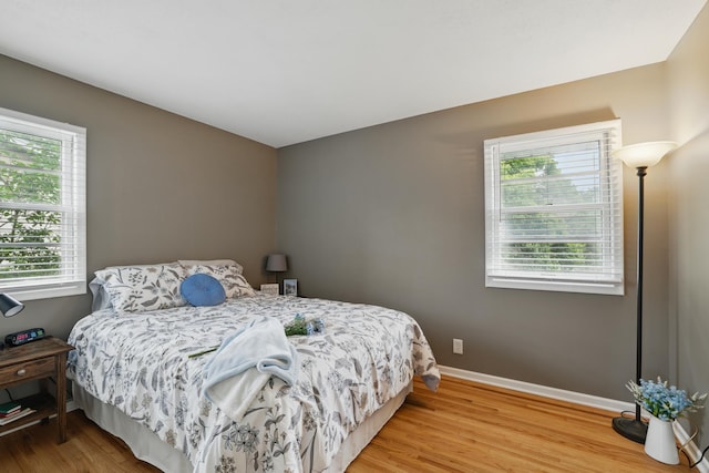 8307 Johnson Ave S, Bloomington, MN 55437 - bedroom featuring wood finished floors and baseboards