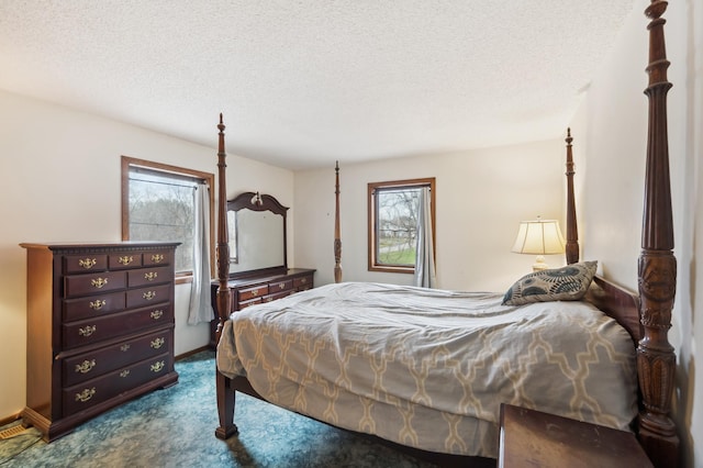 1601 Welland Ave, Minnetonka, MN 55305 - bedroom with multiple windows, dark colored carpet, and a textured ceiling