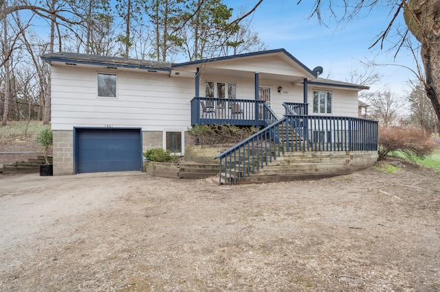 1601 Welland Ave, Minnetonka, MN 55305 - ranch-style home with a porch, driveway, stairs, and a garage