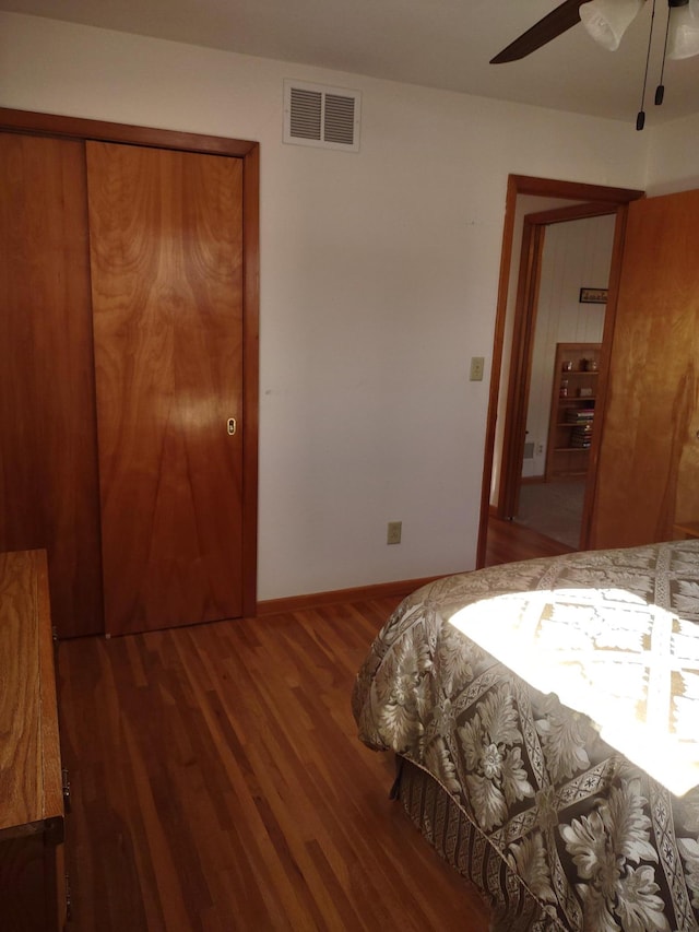 522 6th Ave, Madison, MN 56256 - bedroom featuring wood finished floors, a ceiling fan, and a closet