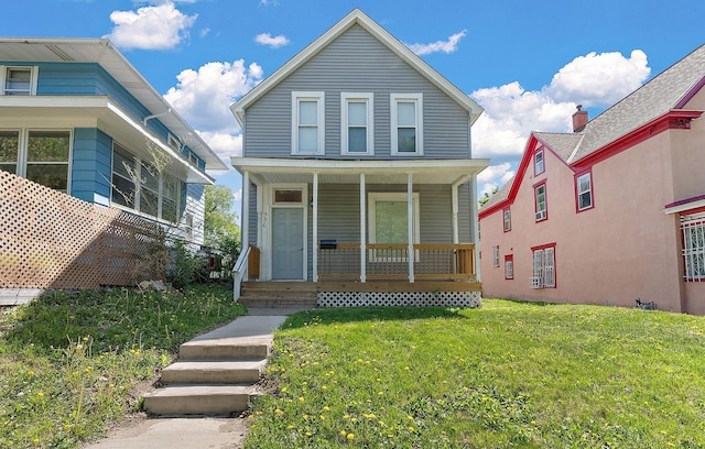 936 Westminster St, Saint Paul, MN 55130 - view of front facade featuring covered porch and a front yard