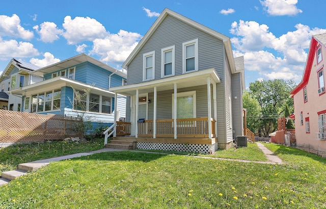 936 Westminster St, Saint Paul, MN 55130 - view of front of property featuring covered porch, a front yard, and central AC unit