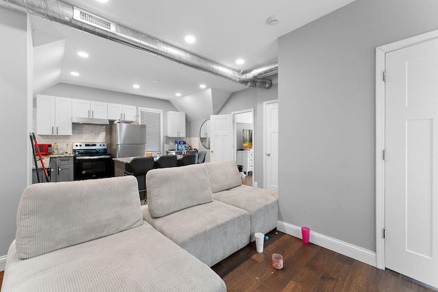 936 Westminster St, Saint Paul, MN 55130 - living room featuring dark wood-style flooring, recessed lighting, baseboards, and vaulted ceiling