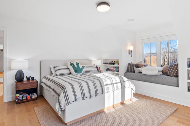 bedroom with wood finished floors