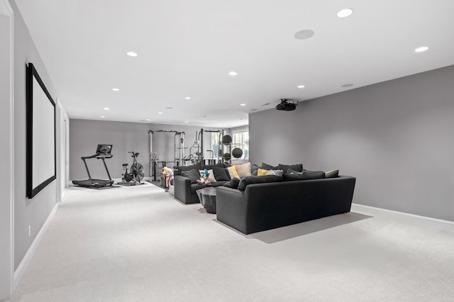 living room featuring light colored carpet, recessed lighting, and baseboards