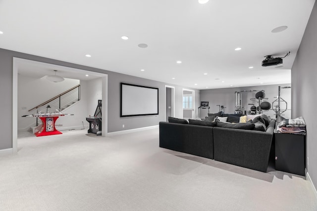 carpeted living room with stairs, baseboards, and recessed lighting