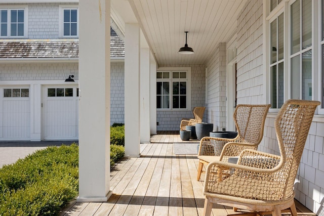 wooden terrace with a porch