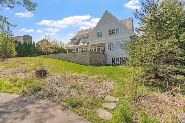 back of house with a yard