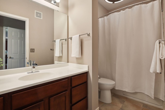 full bath with visible vents, vanity, and toilet