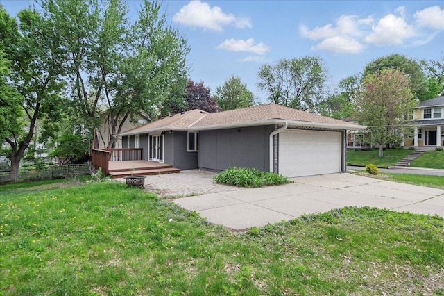 ranch-style house with an attached garage, a wooden deck, and driveway